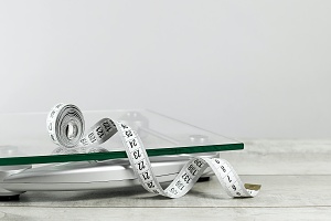 white tape measure and scale for Weight Management