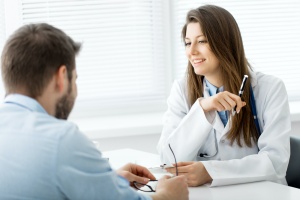 doctor listening to someone talk about mental wellness