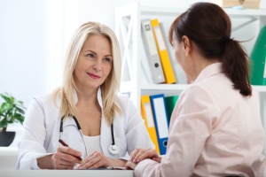 Patient talking with doctor about Womens Wellness