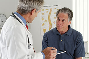 doctor explaining risks after cholesterol screening