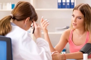 girl discussing health issues with doctor