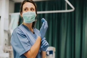 nurse practitioner wearing mask and gloves