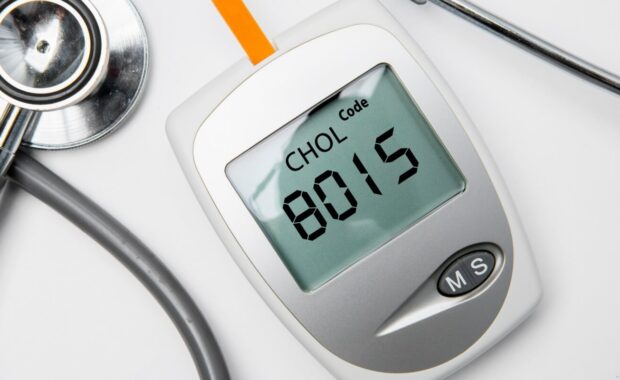 medical device for measuring cholesterol with stethoscope on the table