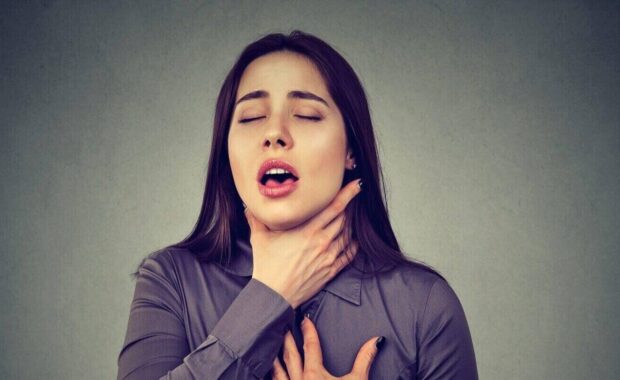 woman having asthma attack