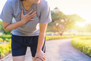 A man experiencing shortness of breath during a morning walk