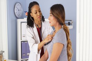 A female gynecologist doing preventive care check-up of a woman