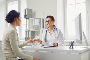 A woman consulting a female gynecologist