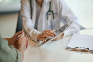 A doctor showing a list to her patient