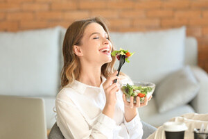 A woman eating healthy food