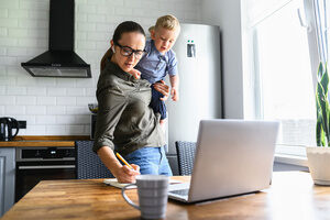 A woman is busy managing a work-life balance