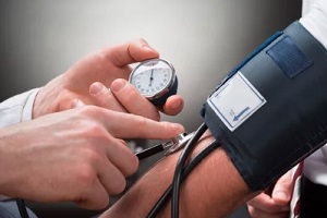 checking blood pressure with instrument
