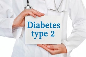 doctor holding type 2 diabetes board