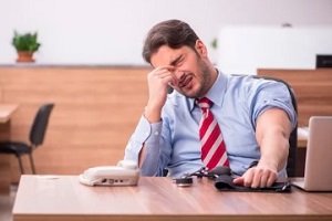man feeling stressed in the office
