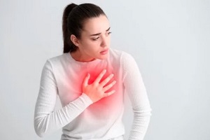 woman having chest pain