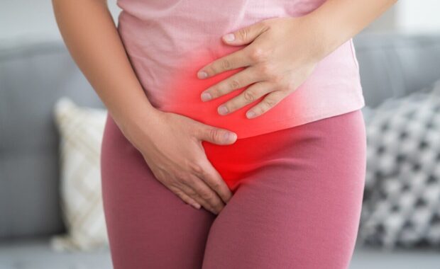 woman with stomachache suffering from pms at home