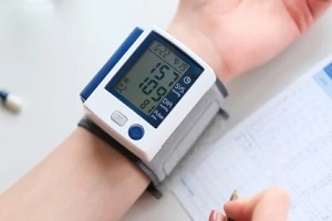 patient measuring blood pressure