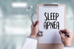 doctor writing sleep apnea on paper