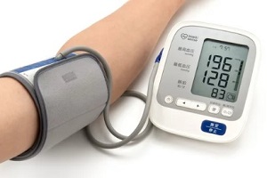 person measuring chronic hypertension