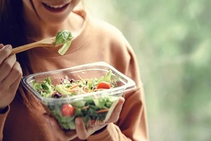 women eating salad