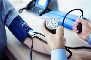 measuring blood pressure of the patient