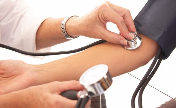 Durham, NC physician checking blood pressure