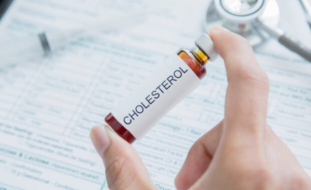 Durham, NC doctor hand holds drug for cholesterol