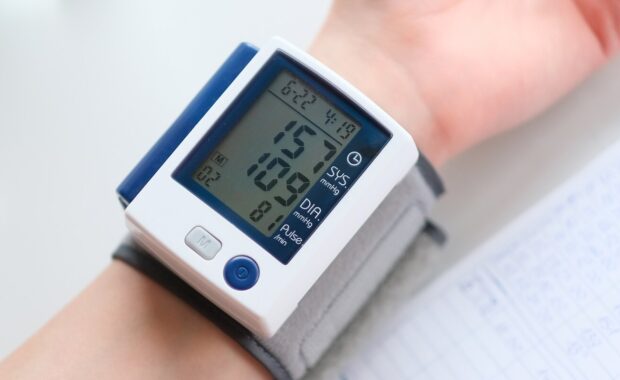 NC patient measuring blood pressure with wrist meter