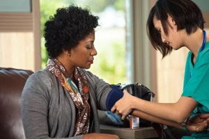 North Carolina nurse checking a patients blood pressure
