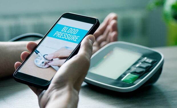 man checks his blood pressure in mobile