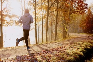 Durham, NC man running in park at autumn morning