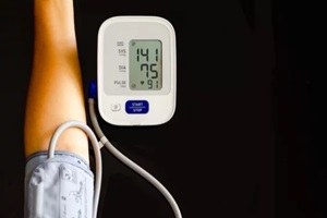 woman take care for health, using sphygmomanometer to measure blood pressure