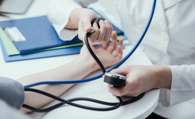 Durham, NC primary care doctor measuring blood pressure
