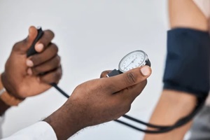 doctor hands measuring blood pressure