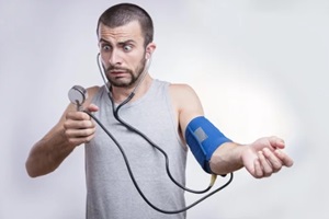 young man shocked and surprised by his blood pressure results