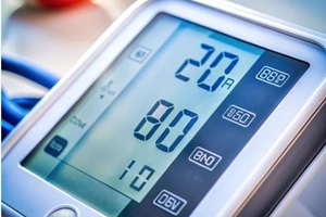 a close-up of blood pressure readings on a monitor