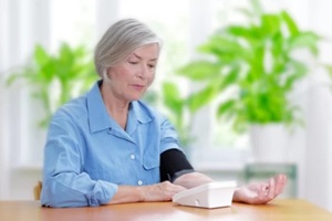 senior woman measuring blood pressure