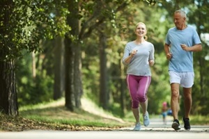 old couple running in the park