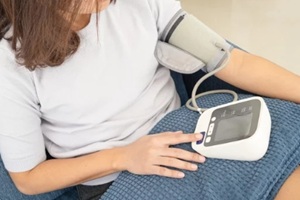 women measuring blood pressure for potential hypertension