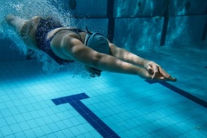 women diving in water
