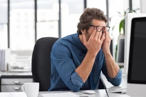 stressed man in office