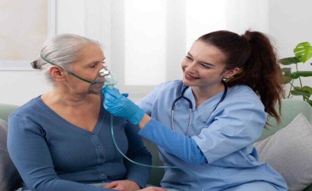 Durham, NC Doctor Giving Oxygen Therapy to Elderly Woman at Home