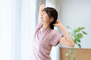 woman practicing yoga at home
