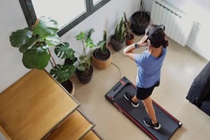 woman exercising on a smart treadmill at home